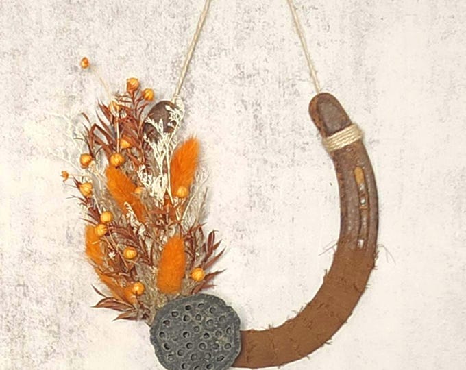 Hand decorated worn horseshoe
