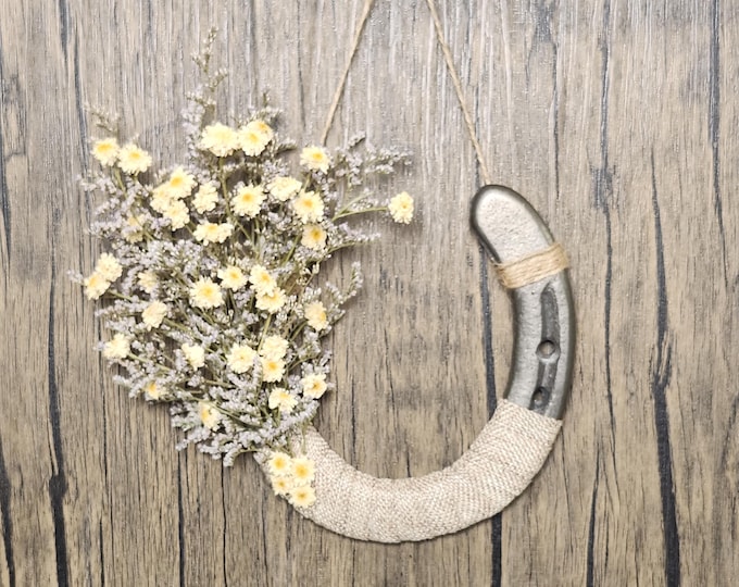 Hand decorated worn horseshoe