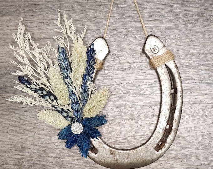 Hand decorated worn horseshoe
