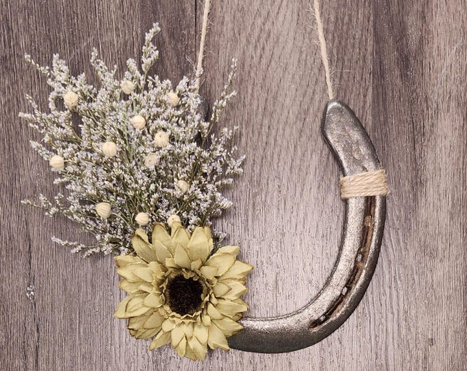 Hand decorated worn horseshoe