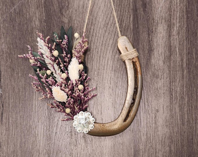 Hand decorated worn horseshoe