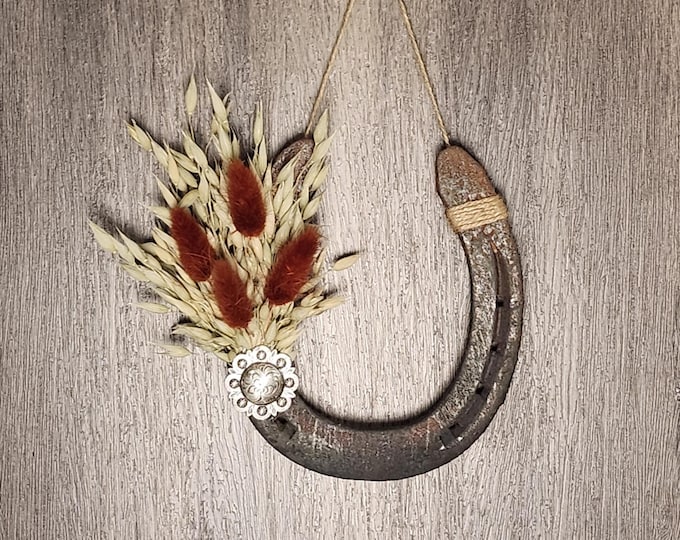 Hand decorated worn horseshoe