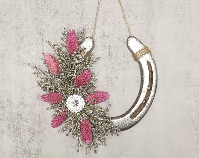 Hand decorated worn horseshoe