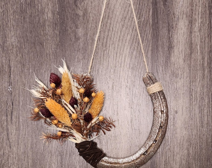 Hand decorated worn horseshoe