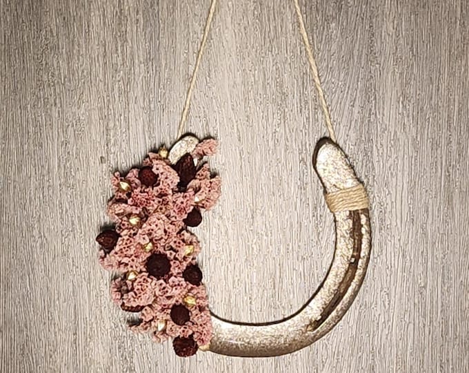 Hand decorated worn horseshoe