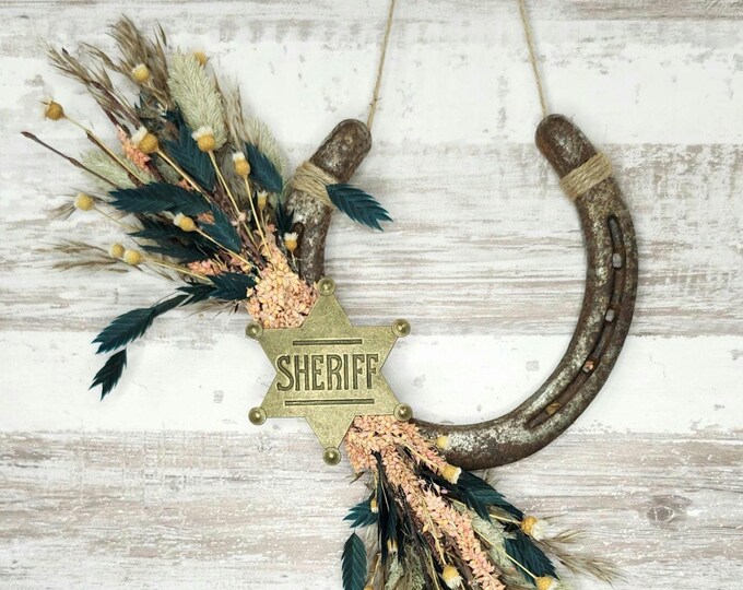 MARSALL DILLON hand decorated worn horseshoe for your home or makes a great gift.