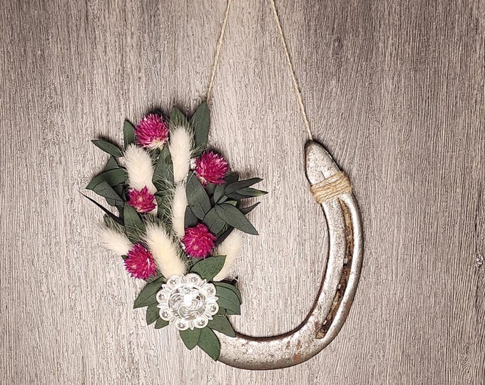 Hand decorated worn horseshoe