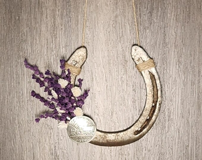 Hand decorated worn horseshoe