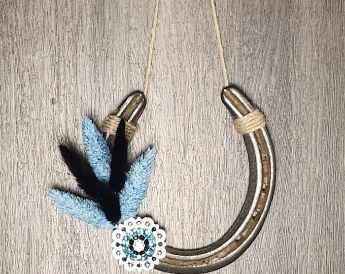 Hand decorated worn horseshoe