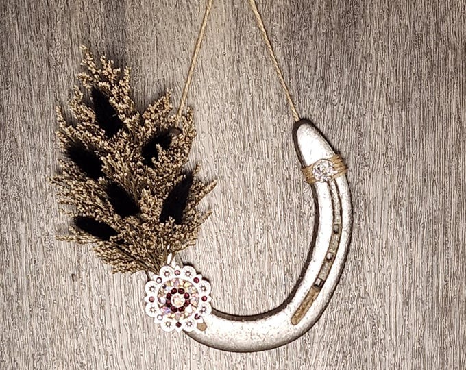 Hand decorated worn horseshoe