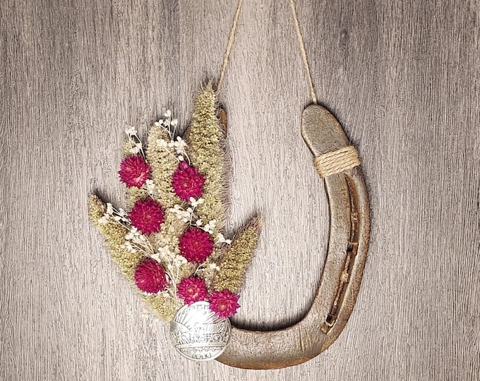 Hand decorated worn horseshoe
