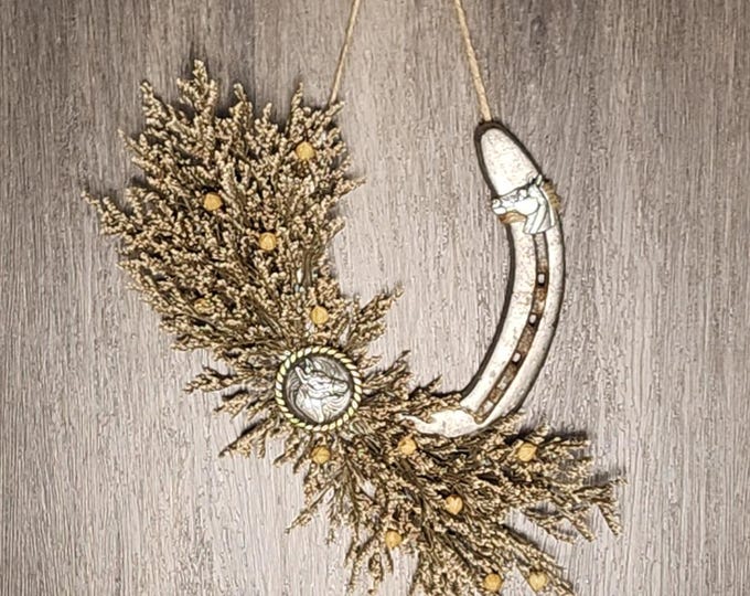 Hand decorated worn horseshoe