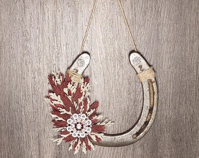 Hand decorated worn horseshoe