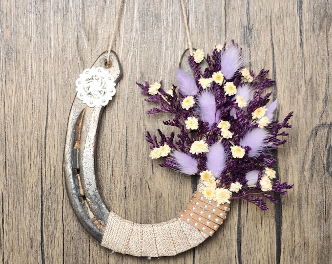Hand decorated worn horseshoe