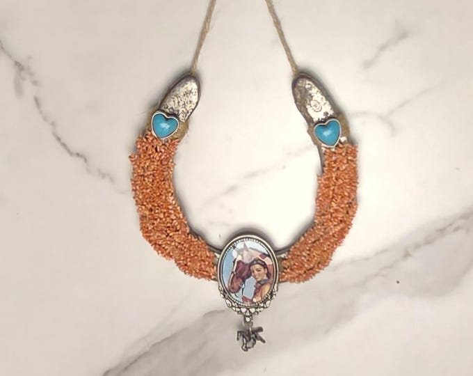 Hand decorated worn horseshoe