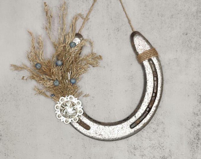 Hand decorated worn horseshoe