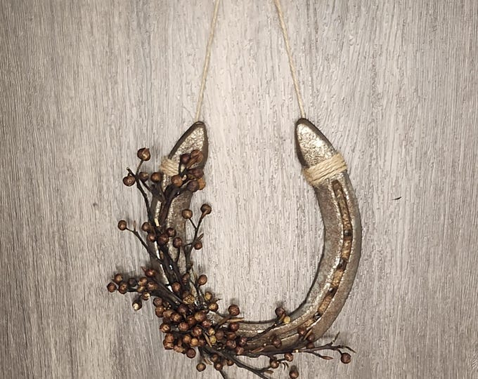 Hand decorated worn horseshoe