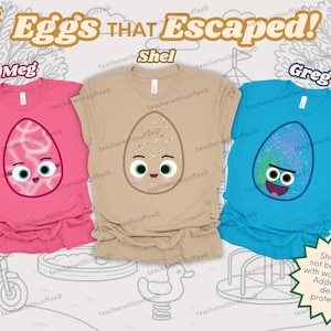 May include: Three colorful t-shirts with egg-shaped cartoon characters. The shirts are pink, tan, and blue, each with a different egg design and name: Meg, Shel, and Greg. The text "The Eggs That Escaped!" is at the top.