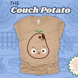 May include: Tan t-shirt featuring a cartoon potato character with a sprout, brown spots, and a smiling face. The text "THE Couch Potato" is arched above the potato design. The background shows a playground scene.