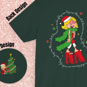May include: A green t-shirt with a cartoon illustration of a woman wearing a red Santa hat and a green scarf. The text around the illustration reads "This is what dreams are made of hey now hey now this is what dreams are made of hey now hey now".