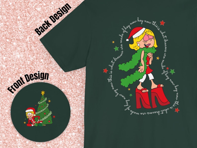May include: A green t-shirt with a cartoon illustration of a woman wearing a red Santa hat and a green scarf. The text around the illustration reads "This is what dreams are made of hey now hey now this is what dreams are made of hey now hey now".
