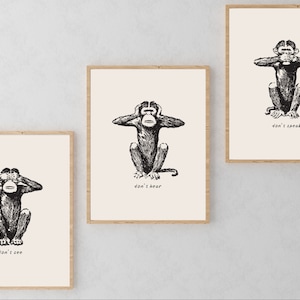 May include: Three framed prints of monkeys covering their eyes, ears, and mouth. The monkeys are black and white illustrations. The text below each monkey reads "don't see", "don't hear", and "don't speak".