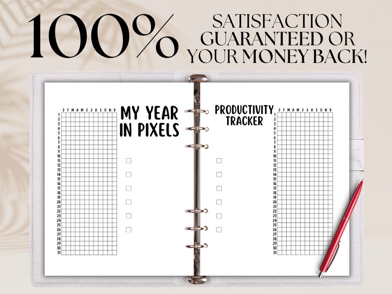 May include: A white planner with a black and white grid on each page. The left page has the text "My Year in Pixels" and the right page has the text "Productivity Tracker".