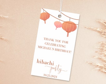 May include: White thank you tag with orange and pink paper lanterns hanging from a string. The text reads "Thank you for celebrating Michael's birthday! hibachi party 10.25.2024"