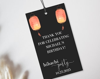 May include: Black thank you tag with white text that says "Thank you for celebrating Michael's birthday! hibachi party 10.25.2025". Two red and orange paper lanterns are on the top of the tag.