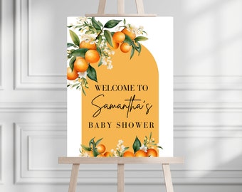 May include: A welcome sign for a baby shower with a yellow background and orange blossoms. The text reads "Welcome to Samantha's Baby Shower".