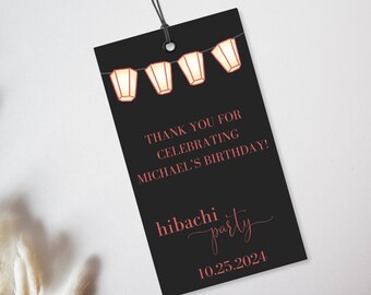 May include: Black thank you tag with red text that says "Thank you for celebrating Michael's birthday!" and "Hibachi party" with the date "10.25.2024". The tag has a string attached and is decorated with a string of paper lanterns.