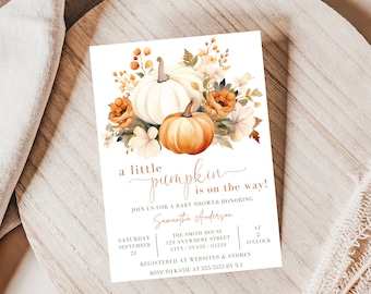 May include: A baby shower invitation with a watercolor illustration of pumpkins and fall flowers. The text reads "a little pumpkin is on the way!" and includes the date, time, and location of the event.