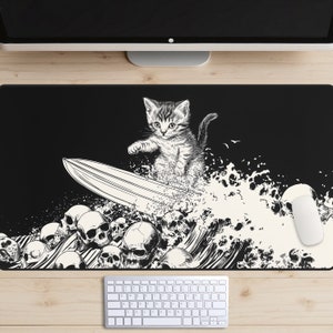 May include: Black and white illustration of a kitten surfing on a wave with a skull motif. The kitten is standing on a surfboard and riding a wave with a skull design. The background is black.