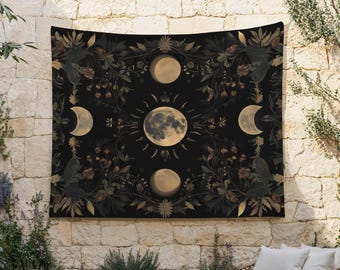 May include: A black tapestry with a floral design and multiple moons in gold and white. The tapestry features a large, central moon with a sunburst design.