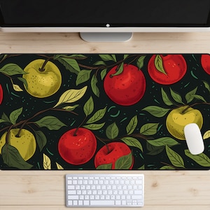 May include: A black mouse mat with a repeating pattern of red and yellow apples on green branches. The apples are drawn in a vintage style.