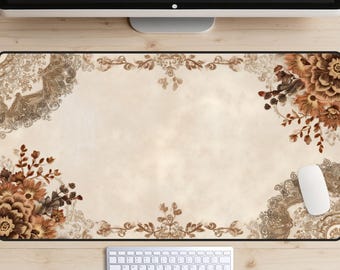 May include: A decorative computer mouse pad with a floral design in shades of brown and beige. The pad features a large central space for the mouse, with a keyboard and mouse visible below. The design includes floral and lace-like patterns.
