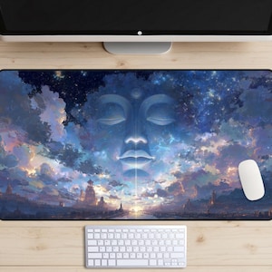 May include: A rectangular mouse pad featuring a serene image of a Buddha face against a backdrop of a celestial landscape with clouds and a city. The color palette includes blues, whites, and hints of gold. A white computer mouse and keyboard are also visible.