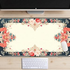 May include: A floral patterned desk mat with a dark blue background and a white center. The mat features pink, red, and green flowers with a vintage aesthetic.