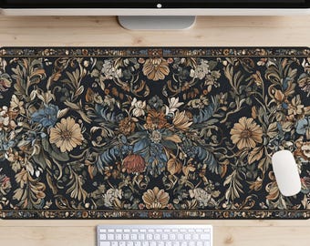 May include: A black and white floral patterned desk mat with a white keyboard and a white mouse on a wooden surface.
