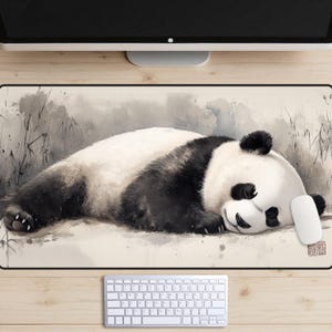 May include: A black and white panda bear sleeping on a beige background with a watercolour effect. The panda is lying on its side with its head resting on its paws. The background is a light beige with a watercolour effect.