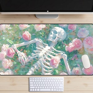 May include: A white skeleton lying on a bed of pink roses and green leaves. The skeleton is surrounded by pink roses and green leaves. The background is a light blue color.