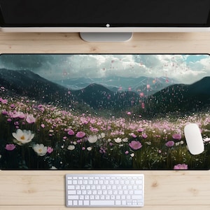 May include: A digital art print featuring a field of pink and white flowers in a mountainous landscape with a cloudy sky. The image has a digital glitch effect.