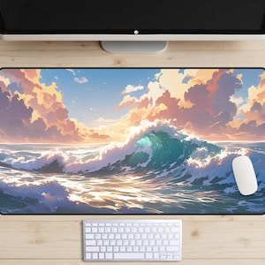 以下が含まれることがあります： 青と白のデジタルアートが描かれたマウスパッド。大きな波が海に打ち寄せ、上空には雲が広がっている。