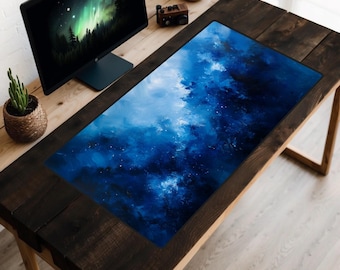 May include: A blue and white abstract design desk mat with a dark wood desk surface. The desk mat is made of a soft, smooth material and is perfect for protecting your desk from scratches and spills.