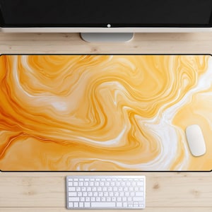 May include: A set of three ceramic mugs with a speckled, matte finish. The mugs are in shades of cream, light gray, and dark gray. Each mug has a simple, minimalist design, perfect for coffee or tea.