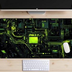 May include: A black and green mouse mat with a circuit board design. The circuit board is glowing green and has a central processing unit in the centre.