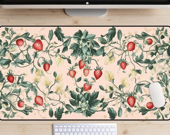 May include: A pink and green floral patterned mousepad with red strawberries. The mousepad has a black border.