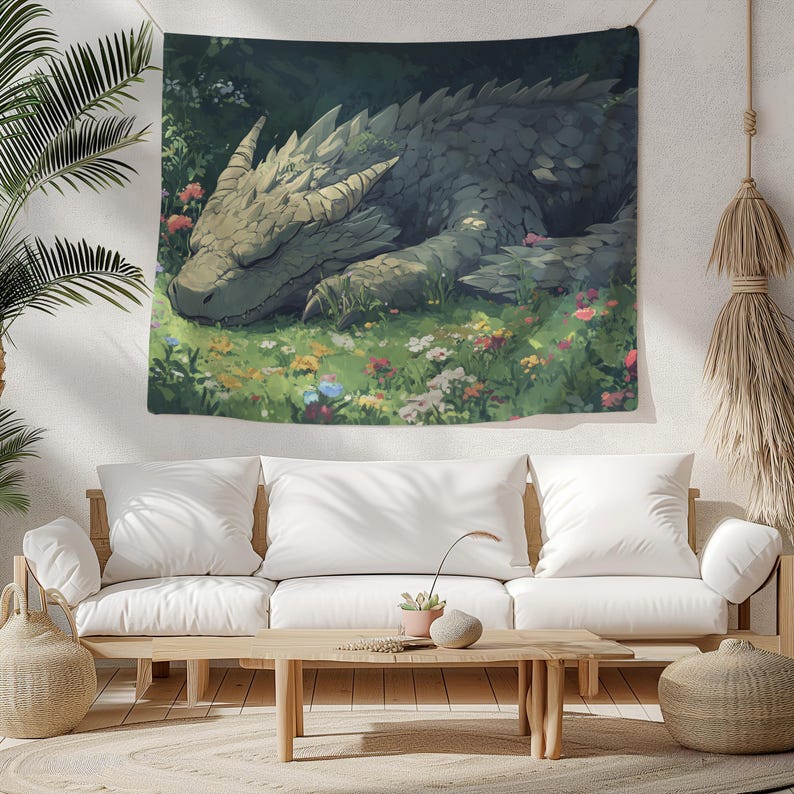 May include: A tapestry featuring a green, brown, and gray dragon sleeping in a field of colorful flowers. The dragon has a long snout and large, scaly wings.