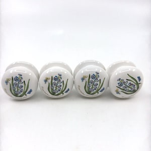 May include: A set of three ceramic mugs with a speckled, matte finish. The mugs are in shades of cream, light gray, and dark gray. Each mug has a simple, minimalist design, perfect for coffee or tea.