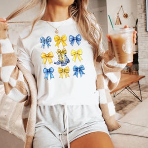 Camiseta unisex lazo coqueto, FFA, agricultura, educación, azul y dorado